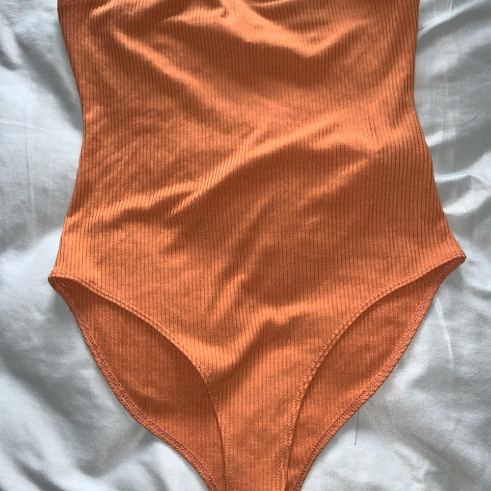 Orange body suit